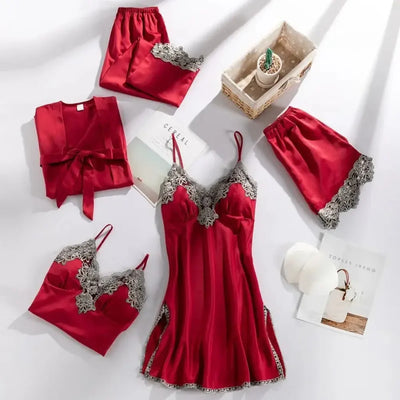 Red satin five-piece pajama set with gray scalloped lace trim flat lay