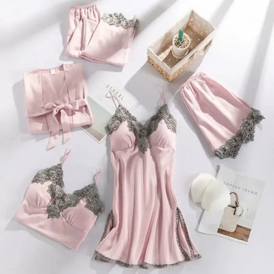 Pink satin five-piece pajama set with gray scalloped lace trim flat lay