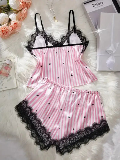 Pink striped satin cami top with black lace neckline and matching shorts, overhead view