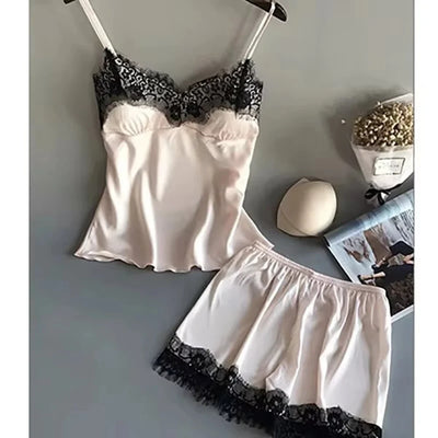 Blush satin cami and shorts pajama set with black floral lace trim on hanger