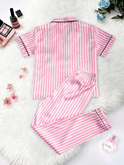 Flat lay back view of pink and white striped satin pajama set showing short-sleeve top and full-length pants with black piping