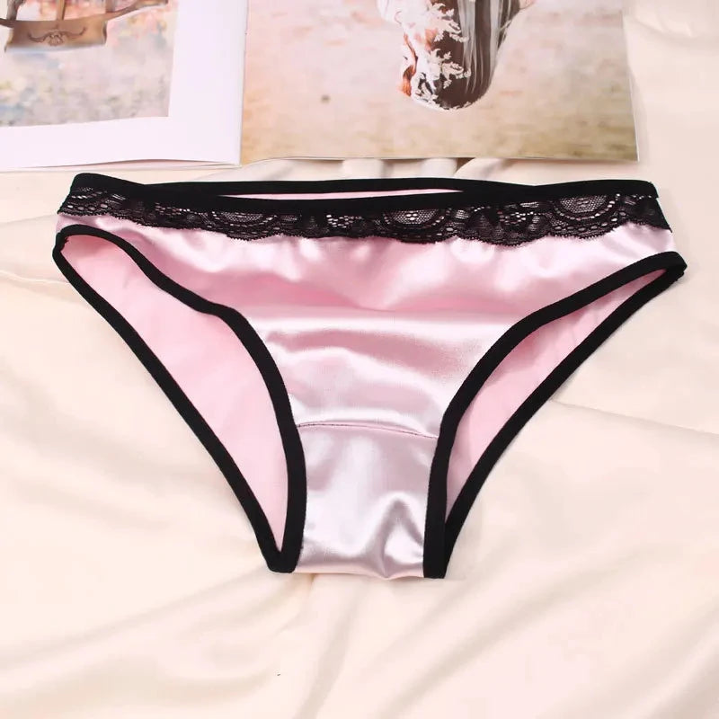 Pink satin bikini panties with black lace waistband and contrast trim flat lay