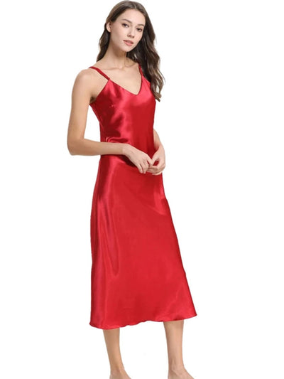 Woman wearing red satin midi nightgown with V-neckline and adjustable straps, three-quarter view