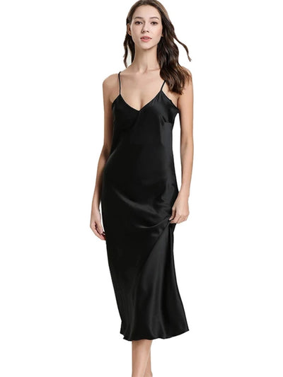 Woman wearing black satin midi nightgown with V-neckline and thin adjustable straps, front view