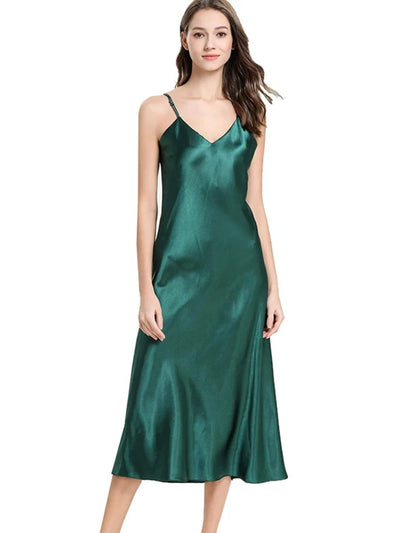 Woman wearing emerald green satin midi nightgown with V-neckline and adjustable straps, front view