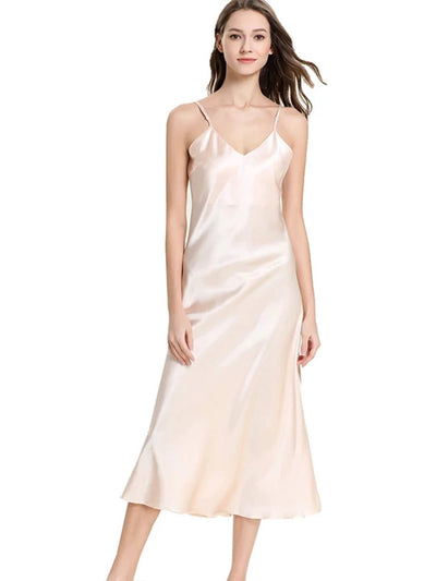 Woman wearing champagne satin midi nightgown with V-neckline and thin adjustable straps, front view