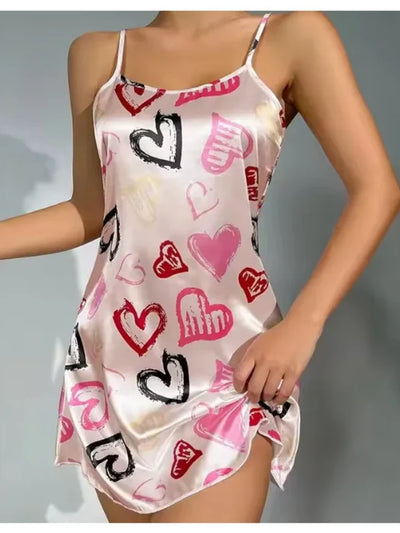 Front view of blush satin mini nightgown with graffiti heart print and spaghetti straps