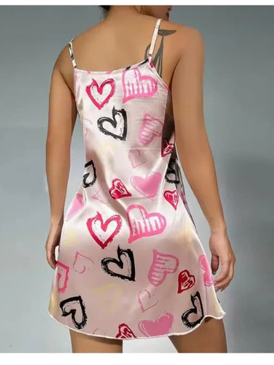 Back view showing open back adjustable strap hardware on heart print satin nightgown