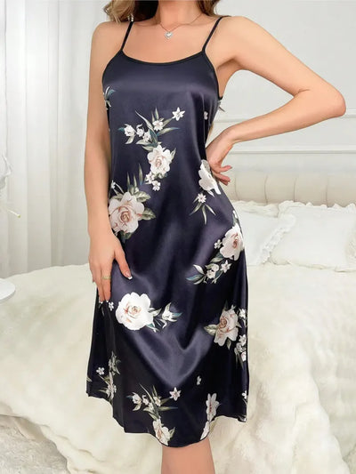 Full-length front view of navy rose print nightgown with hand on hip, midi hem visible
