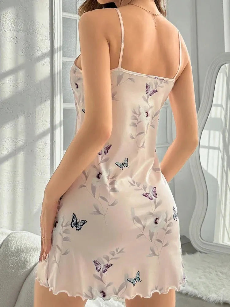 Back view of blush butterfly print slip nightgown with spaghetti straps and ruffled hem