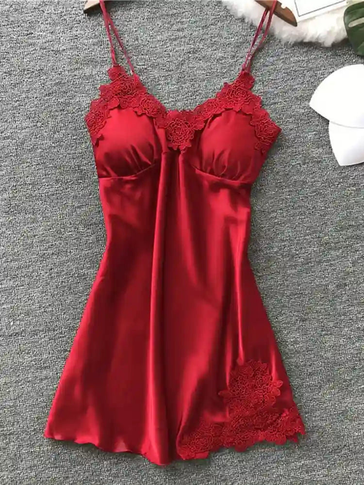 Red satin mini nightgown with floral lace applique at V-neckline and hem, flat lay on gray surface