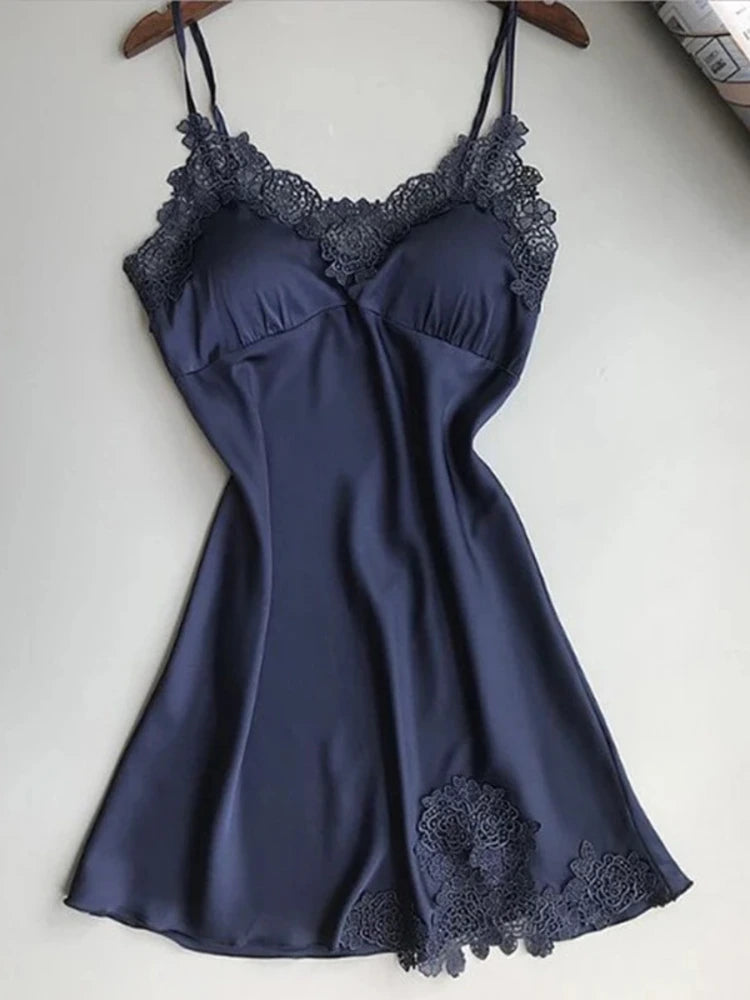 Navy satin nightgown with V-neck lace appliqué trim and adjustable spaghetti straps, flat lay on hanger