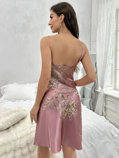 Back view of a pink floral satin mini nightgown with open back and adjustable shoulder straps