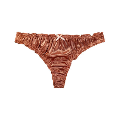 Product shot of terracotta satin thong panties with ruffled waistband and ribbon bow on white background