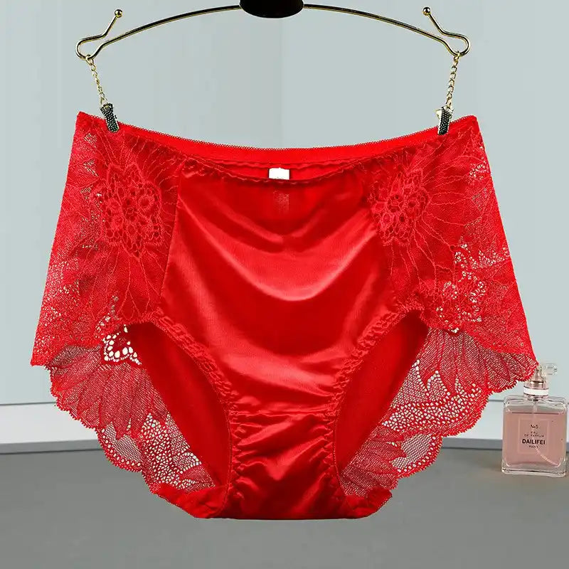 Red satin panties with open floral lace side panels hanging on display hanger