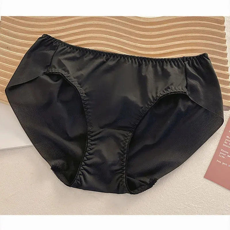 Black mid-rise satin panties with elastic waistband and ribbed side panels, flat lay