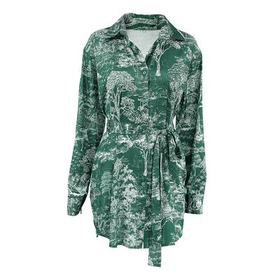 Flat lay of emerald green toile print shirt dress with tie sash, full front view