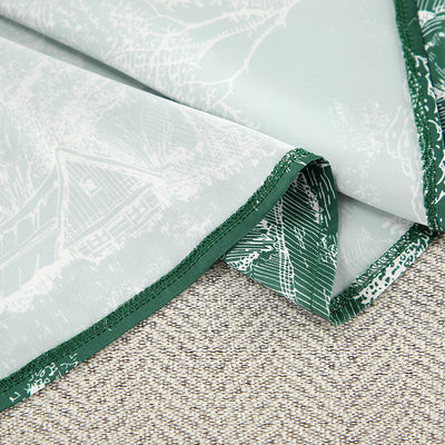 Close-up of shirt dress hem showing lighter mint lining with white toile print
